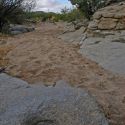 Photo: Desert wash with O'odham grinding hole